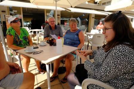 Insurance broker Sophie Goode informs British residents about health care insurance after upcoming Brexit in Benidorm