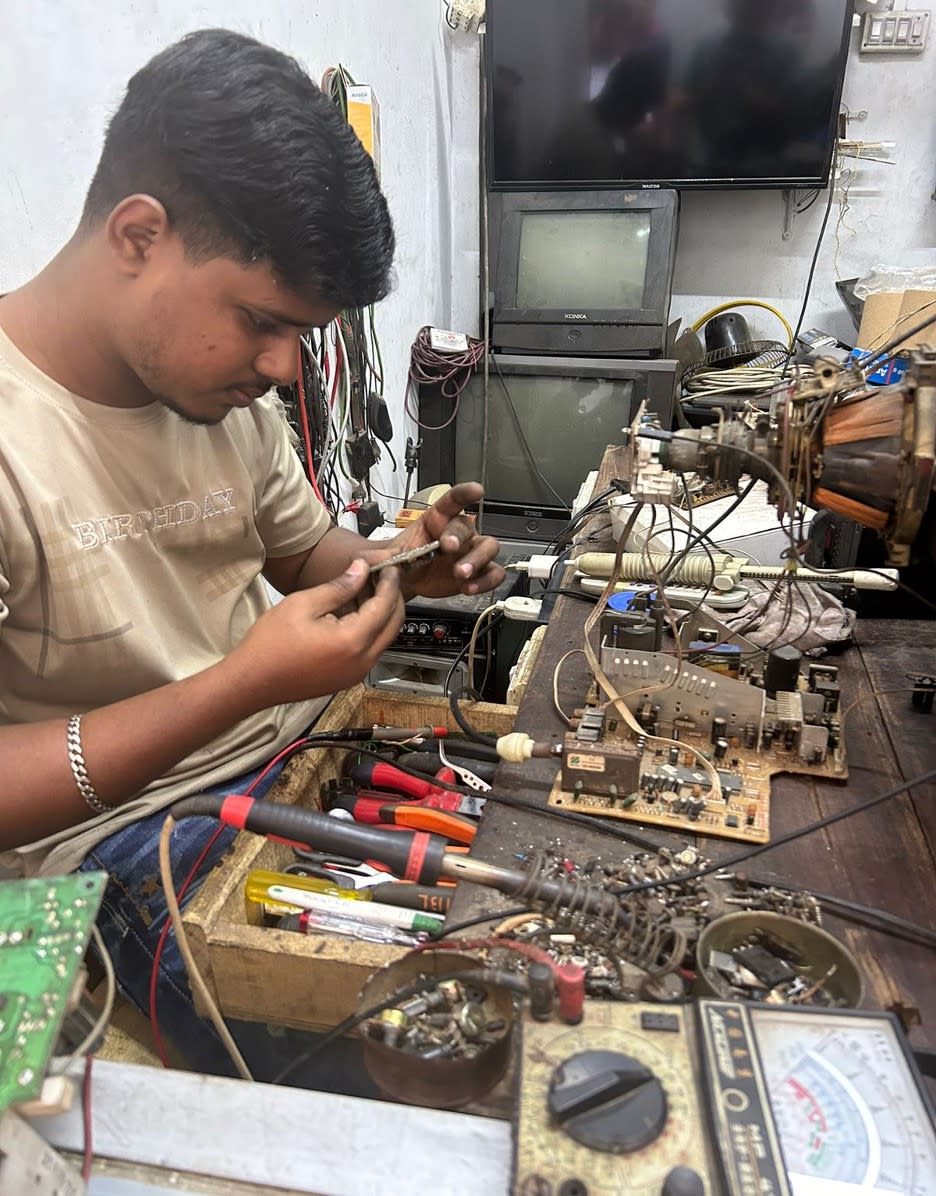 Bangladesh Rural Advancement Committee (BRAC) in Dhaka works with people who re-fix disposed electric items for a living making it safer. (Credit: Supplied)
