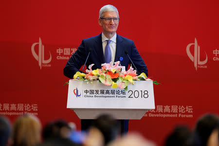 FILE PHOTO: Apple Inc's Chief Executive Officer Tim Cook speaks at the China Development Forum in Beijing, China, March 24, 2018. REUTERS/Stringer ATTENTION EDITORS - THIS IMAGE WAS PROVIDED BY A THIRD PARTY. CHINA OUT./File Photo