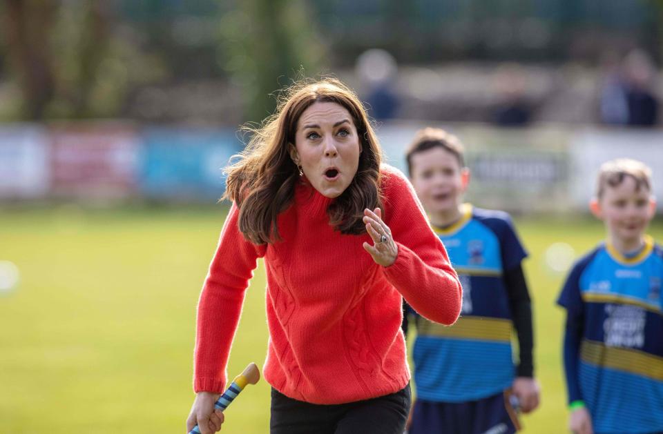 Britain's Catherine, Duchess of Cambridge, reacts after hitting the ball whilst attempting to play hurling during a visit to Salthill Gaelic Athletic Association (GAA) club in Galway, western Ireland, on March 5, 2020 on the final day of their three day visit. (Photo by Paul Faith / AFP) (Photo by PAUL FAITH/AFP via Getty Images)