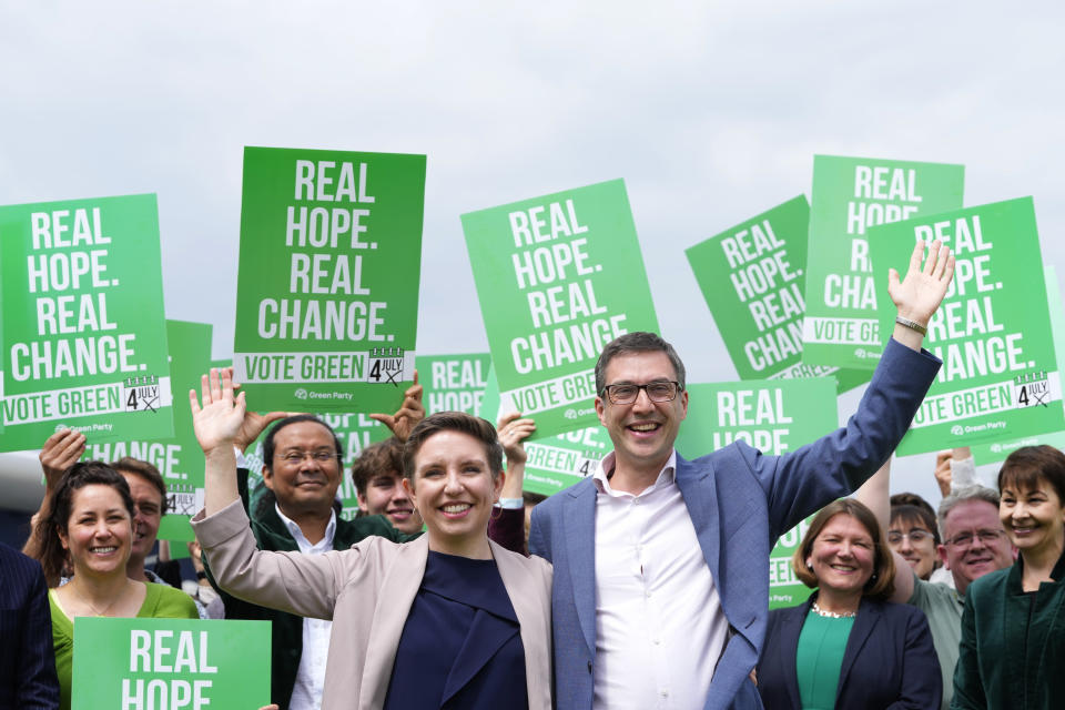 Green Party co-leaders Adrian Ramsay and Carla Denyer pose with supporters at their General Election Manifesto launch - Real Hope, Real Change, at Sussex County Cricket Ground in Hove, England, Wednesday, June 12, 2024. In the build-up to the UK general election on July 4. (AP Photo/Kirsty Wigglesworth)