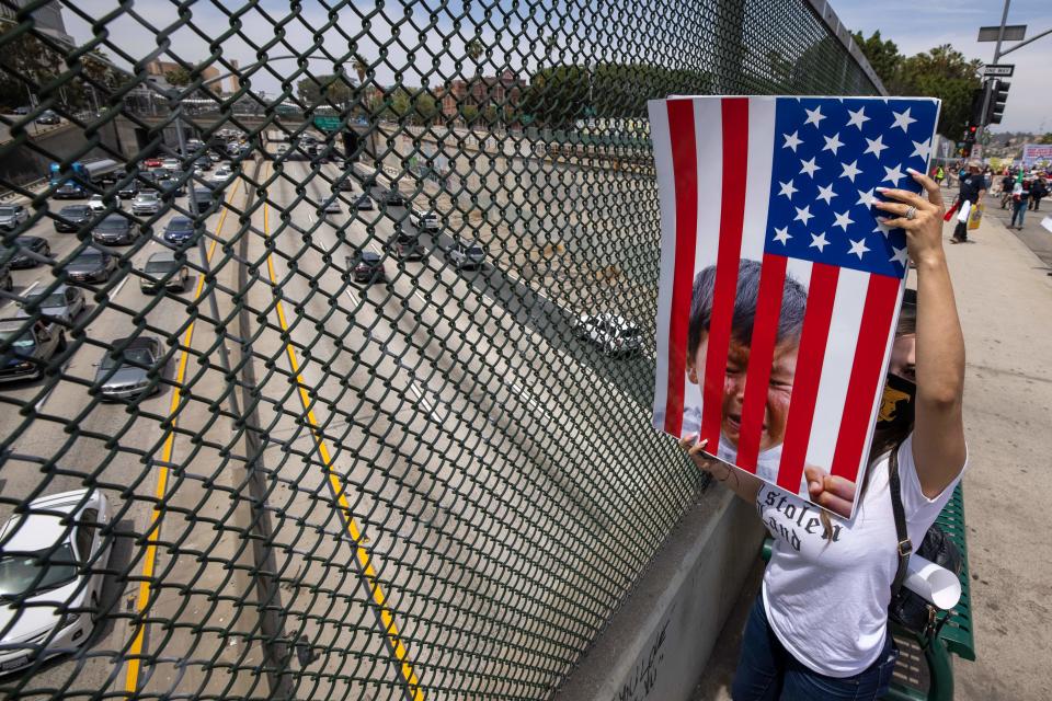 A woman protesting family separations 