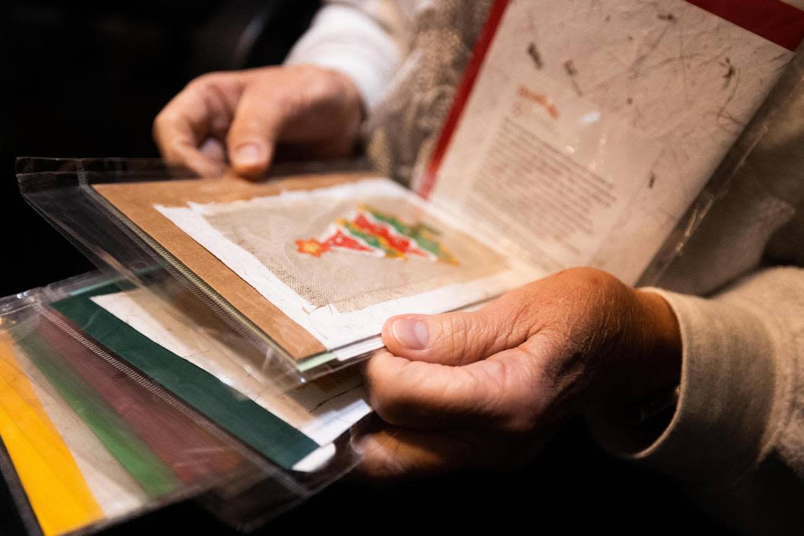 Barbara Velhum looks through the greeting cards for Christmas designs on Wednesday, Oct. 26, 2022, at Honduran Threads in Dallas. All the proceeds go to the Honduran artisans that created the products.