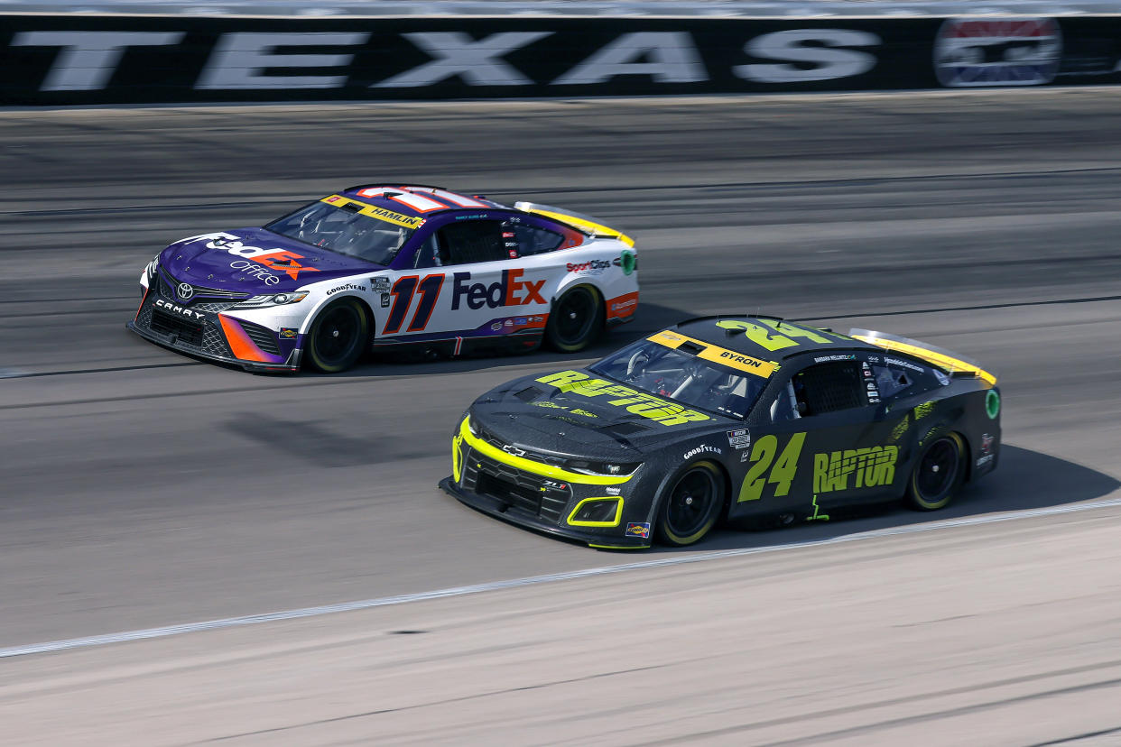 FORT WORTH, TEXAS - SEPTEMBER 25: Denny Hamlin, driver of the #11 FedEx Office Toyota, and William Byron, driver of the #24 RaptorTough.com Chevrolet, race during the NASCAR Cup Series Auto Trader EchoPark Automotive 500 at Texas Motor Speedway on September 25, 2022 in Fort Worth, Texas. (Photo by Jonathan Bachman/Getty Images)