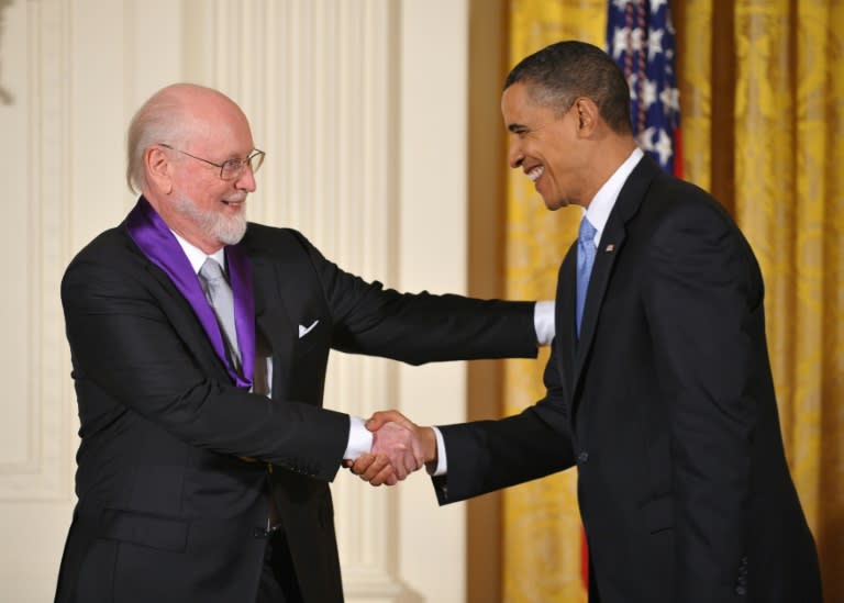 US President Barack Obama presents the 2009 National Medal of Arts to composer John Williams during a ceremony at the White House on February 25, 2010
