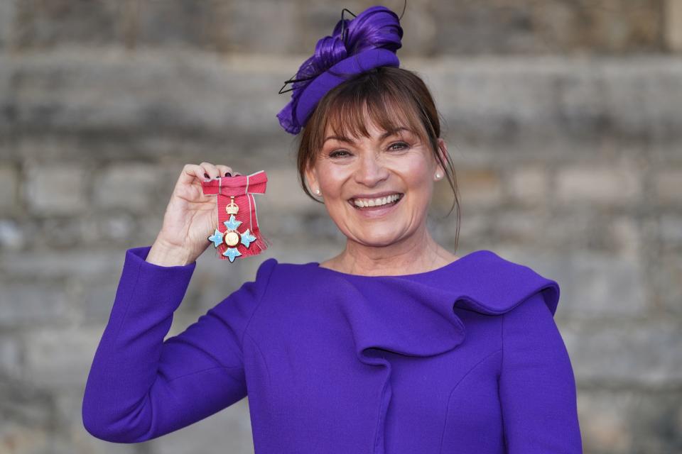 Television presenter Lorraine Kelly poses with her medal after she was appointed a Commander of the Order of the British Empire (CBE) at an investiture ceremony at Windsor Castle, west of London on December 8, 2021. (Photo by Steve Parsons / POOL / AFP) (Photo by STEVE PARSONS/POOL/AFP via Getty Images)