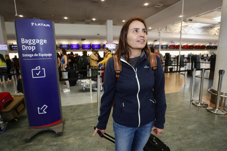 Passenger Janet Baker prepares to check in at Auckland, New Zealand airport for a LATAM Airlines flight to Santiago, Chile, Tuesday, March 12, 2024. At least 50 people were injured Monday by what officials described as a "strong movement" on a Chilean plane traveling from Sydney to Auckland. Baker was on the flight Monday. (Dean Purcell/New Zealand Herald via AP)