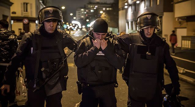 A police officer reacts as he leaves the scene following the hostage situation at Porte de Vincennes. Photo: Getty.