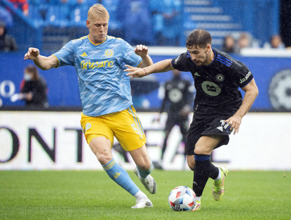 CF Montreal's Matko Miljevic, right, dribbles against Philadelphia Union's Jakob Glesnes during the first half of an MLS soccer game, Saturday, Oct. 16, 2021, in Montreal. (Graham Hughes/The Canadian Press via AP)