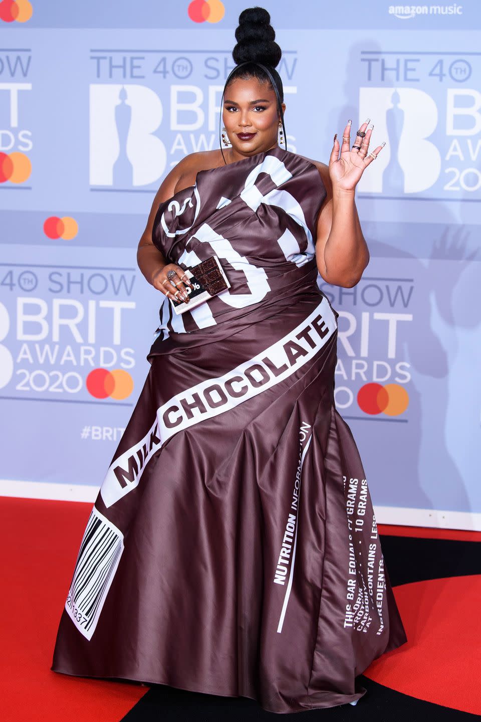 <p>Who: Lizzo </p><p>When: February 18, 2020</p><p>Wearing: Moschino</p><p>Why: We’ve said it once and we’ll say it again: Lizzo is a <em>snack. </em>As her chocolate bar clutch says, this look is 100% what we need to get through the week.</p>