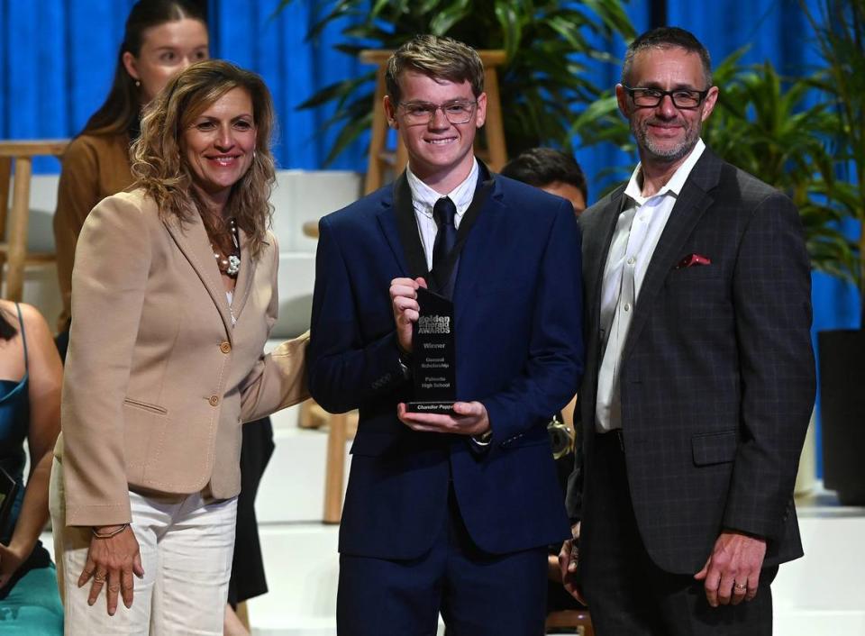 2023 Golden Herald Award winner for General Scholarship Chandler Poppell with presenters Jackie Barron and Tom McDougal Thursday night.