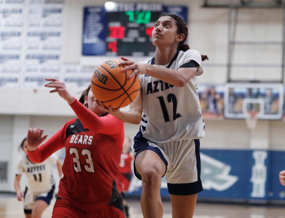 Farmersville's Jazmaine Stewart drives to the basket against Arvin during their Central Section Division V high school girls basketball playoff game in Farmersville, Calif., Thursday, Feb.16, 2022.