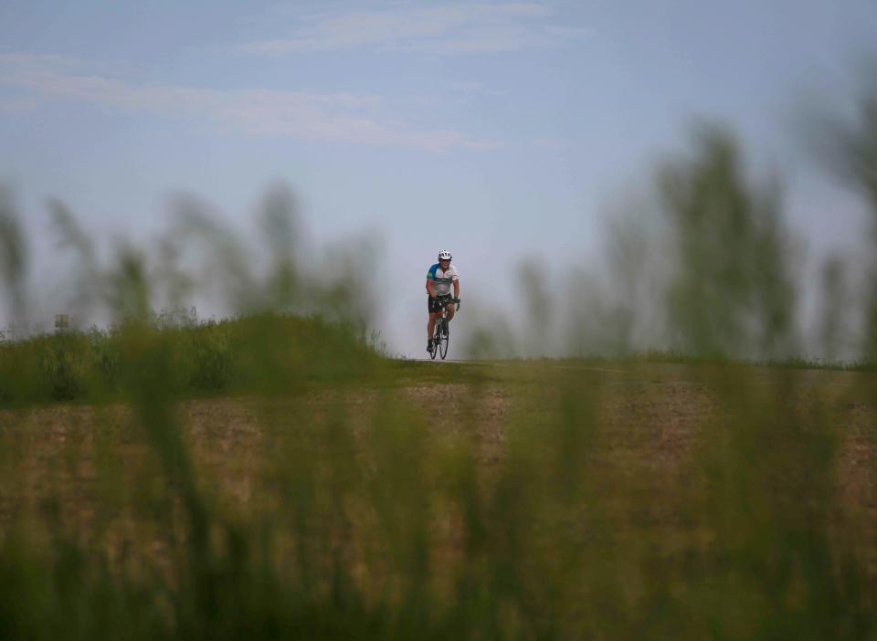 A member of the RAGBRAI route inspection team make rides the day 1 route on Sunday.