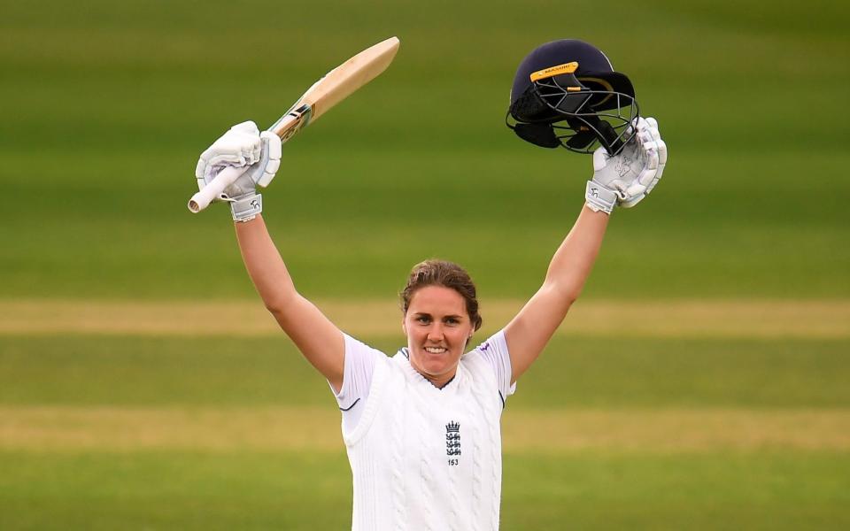 Nat Sciver of England celebrates their century during Day Two of the First Test Match between England Women and South Africa Women at The Cooper Associates County Ground on June 28, 2022 in Taunton, England. - GETTY IMAGES