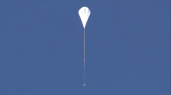 NASA's saucer-shaped Low-Density Supersonic Decelerator prototype is carried skyward by a high-altitude balloon during a Mars landing technology test flight from Kauai, Hawaii on June 8, 2015.