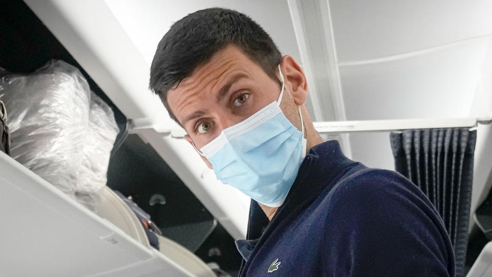 Pictured here, Novak Djokovic on a plane headed home after he was deported from Australia.