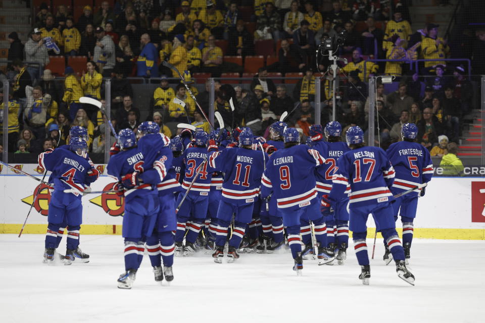 USA players celebrate after winning the IIHF World Junior Championship ice hockey semifinal match between USA and Finland at Scandinavium in Gothenburg, Sweden, Thursday, Jan. 4, 2024. (Adam Ihse/TT via AP)