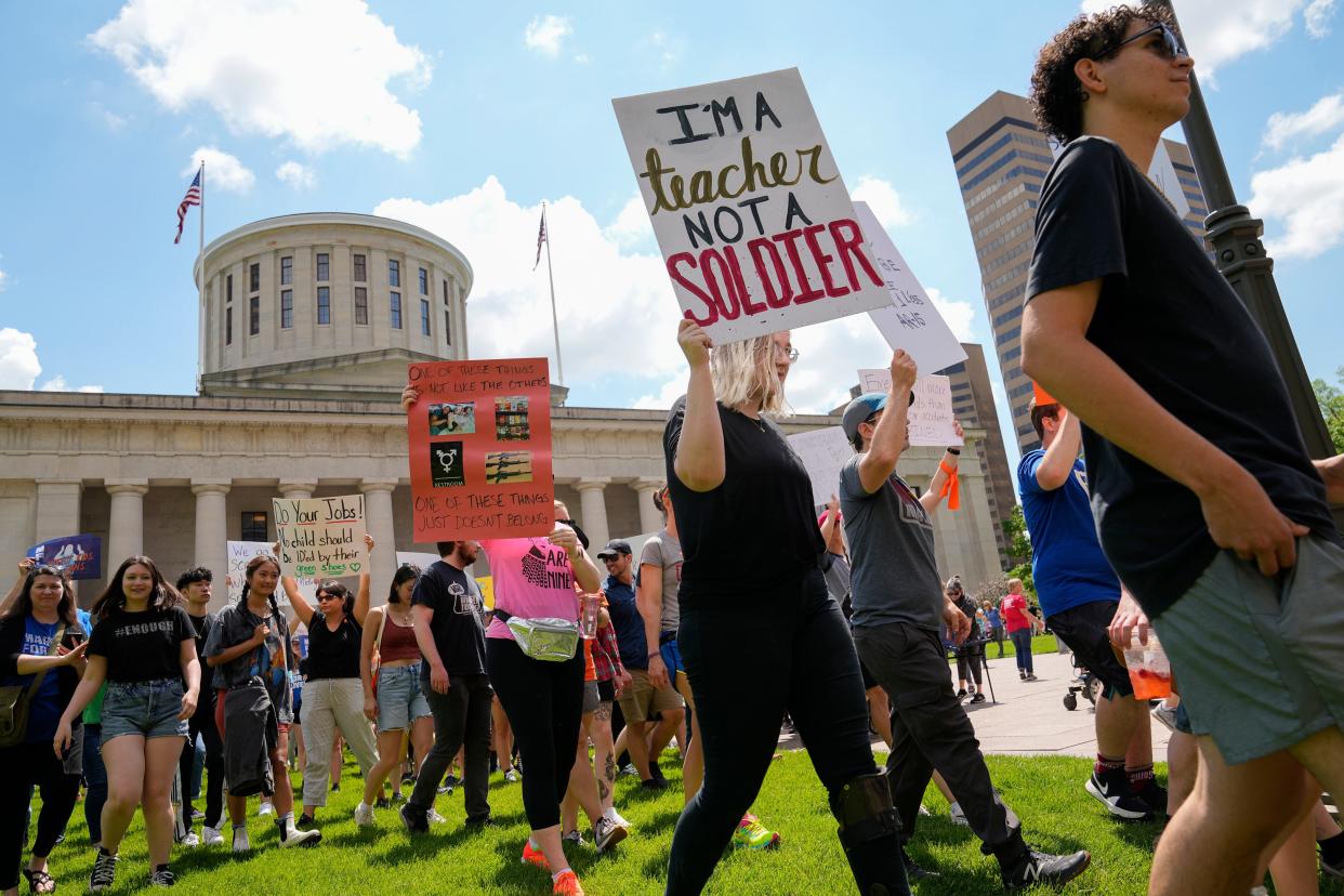 Demonstrators march around the Ohio Statehouse during the March For Our Lives rally against gun violence Saturday, June 11, 2022, in Columbus. Hundreds gathered outside the Statehouse to protest recent mass shootings and encourage lawmakers to pass gun control legislation.