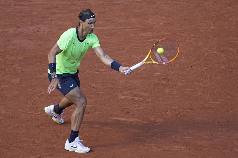 Spain's Rafael Nadal plays a return to Italy's Jannik Sinner during their fourth round match on day 9, of the French Open tennis tournament at Roland Garros in Paris, France, Monday, June 7, 2021. (AP Photo/Michel Euler)