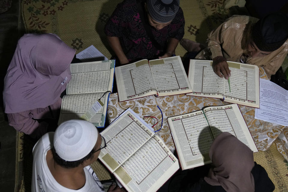 Trans women attend a Quran reading class at Al Fatah Islamic school in Yogyakarta, Indonesia, Sunday, Nov. 6, 2022. The school whose students are transgender women is a rare oasis of LGBTQ acceptance – not only in Indonesia, but across the far-flung Muslim world. Many Muslim nations criminalize gay sex. (AP Photo/Dita Alangkara)