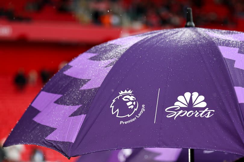 LIVERPOOL, ENGLAND - MARCH 10: A Premier League branded NBC Sports purple umbrella in the rain during the Premier League match between Liverpool FC and Manchester City at Anfield on March 10, 2024 in Liverpool, England.(Photo by Robbie Jay Barratt - AMA/Getty Images)