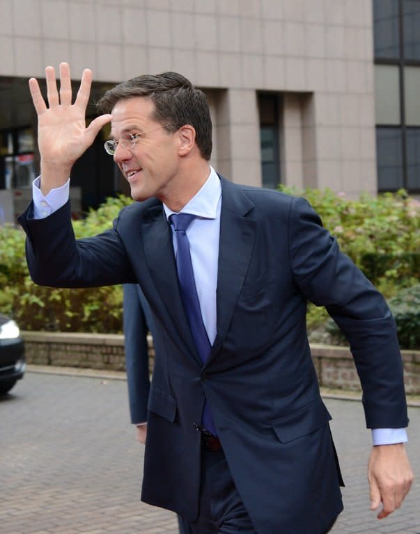 Dutch Prime Minister Mark Rutte arrives at EU Headquarters in Brussels on Friday. Flagship plans to fix fundamental flaws criticised since the introduction of the single currency were put to one side by EU leaders until late 2014 at the earliest