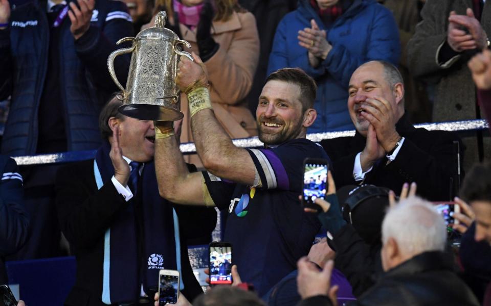 Scotland captain John Barclay lifts the Calcutta Cup - AFP