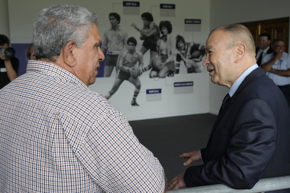 Australia's head rugby union coach Eddie Jones, right, talks with former Wallaby Glen Ella at Matraville Sports High School in Sydney, Tuesday, Jan. 31, 2023. Jones, who was named as new coach of the Australian rugby team on Jan. 16, faced the media on Tuesday in his first appearance since returning to the Wallabies. He will lead the team at the Rugby World Cup later this year in France. (AP Photo/Rick Rycroft)