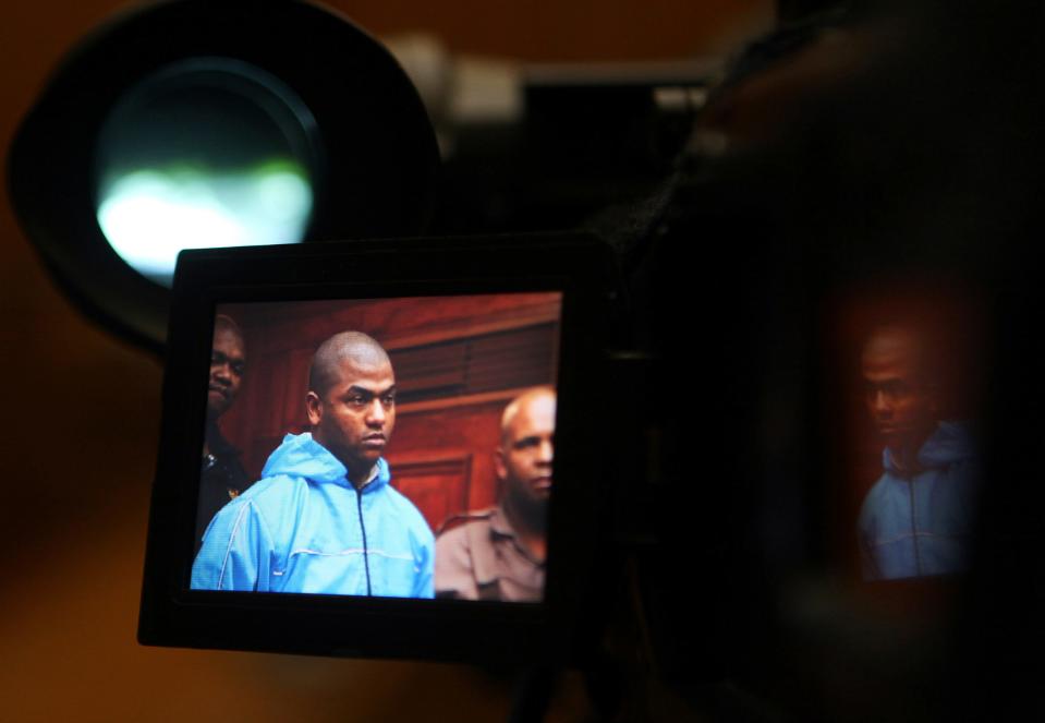 Thabo Bester is seen on a TV camera screen in the Western Cape High Court, in Cape Town, South Africa Thursday, May 3, 2012, where he appeared in connection with murder. The South African convicted murderer who faked his death to escape from prison has been arrested in Tanzania following a two-week manhunt, police have announced. South African officials are going to Tanzania Sunday April 9, 2023, to begin to extradite Thabo Bester.