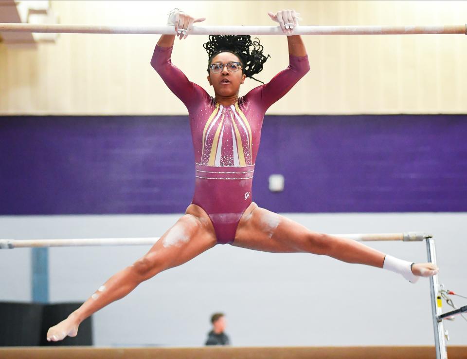 Bloomington North’s Dede Eberle competes on the bars during the gymnastics meet against Bloomington South and Edgewood at South on Monday, Jan. 8, 2024.