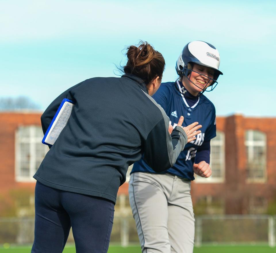 Somerset Berkley’s Gabriella Nugent is greeted at third by coach Sally McKinnon after hitting a home run during a recent game this season