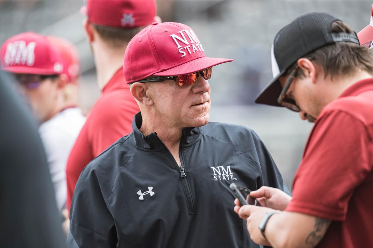 Head coach Mike Kirby is pictured in the dugout as the New Mexico State Aggies face off against the Cal Baptist Lancers at Presley Askew Field in Las Cruces on Friday, May 14, 2021.