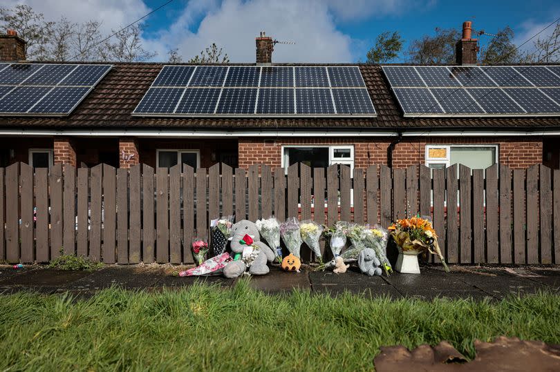 Tributes left at the scene on Marsh Green in Wigan