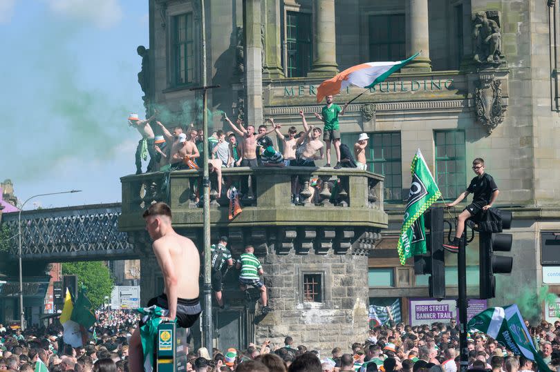 Thousands of Celtic fans celebrate in Glasgows Trongate.