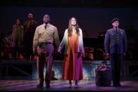 This image released by Polk & Co. shows, foreground from left, Joshua Henry, Sutton Foster and Colin Donnell during a performance of "Violet" in New York. (AP Photo/Polk & Co., Joan Marcus)