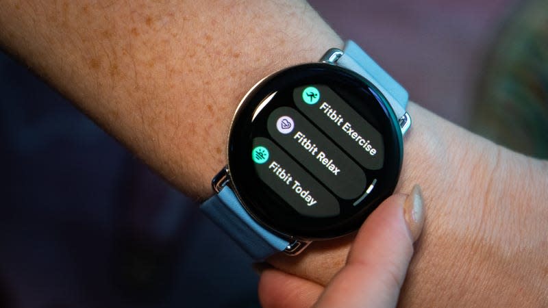 Fitbit features in the Wear OS app drawer on the Pixel Watch 2. The band is the two-tone leather band in Bay. - Photo: Florence Ion / Gizmodo