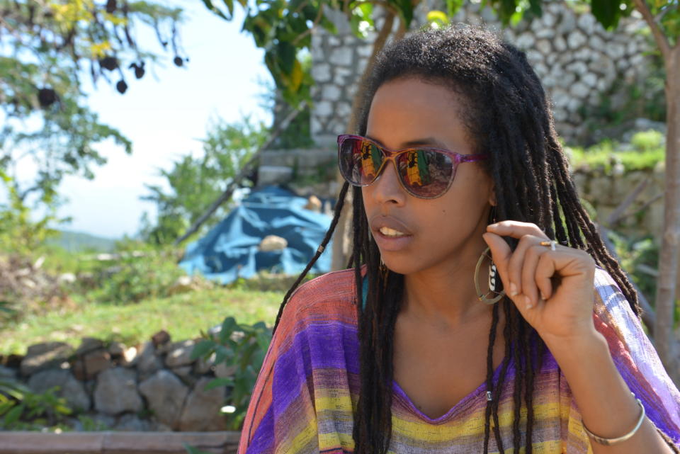 In this Jan. 4, 2014 photo, Donisha Prendergast, the eldest granddaughter of reggae icon Bob Marley, speaks during an interview on a hilltop known to Rastafarians as “Pinnacle” in Sligoville, Jamaica. Rastas are fighting to keep a developer from building on this hilltop, considered sacred to Rastas in southern Jamaica and dubbed "Pinnacle," where Howell founded the first Rastafarian settlement 70 years ago. (AP Photo/David McFadden)