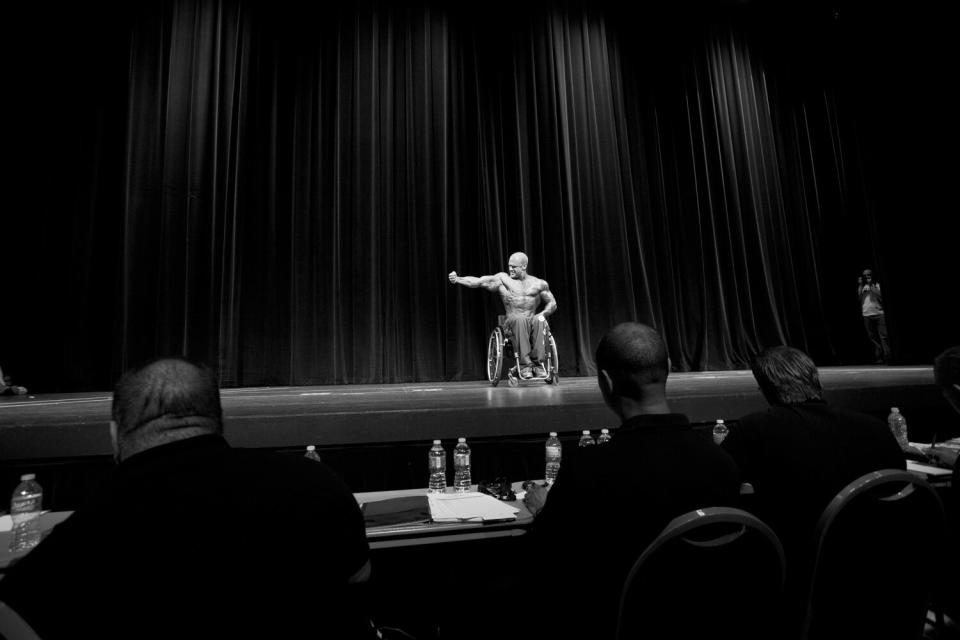 Competitor Dan Smith on stage during his routine in Houston. Smith would compete against seven other professional wheelchair athletes from around the world for a chance to win the overall title.