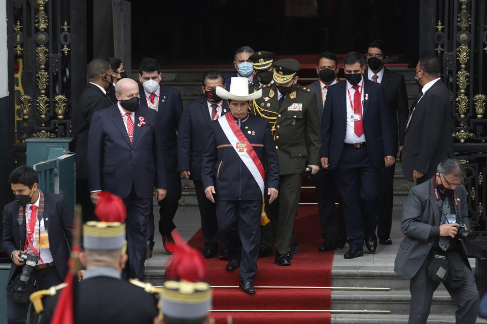 Peru's newly sworn-in President Pedro Castillo exits Congress on his inauguration day in Lima, Peru, Wednesday, July 28, 2021. (AP Photo/Francisco Rodriguez)