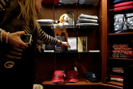 A guest shops for Trump branded items at Trump's Sweet Shop in the lobby of Trump Tower in New York City, U.S., November 23, 2016. Picture taken November 23, 2016. REUTERS/Brendan McDermid