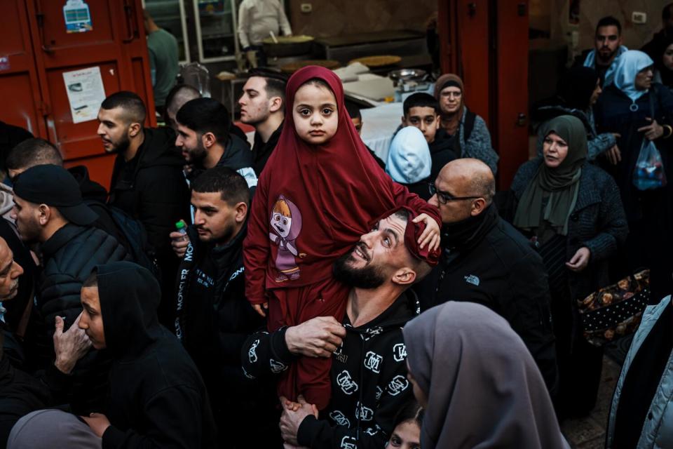 Devout Muslims make the pilgrimage into Al Aqsa carrying their iftar meals, and sometimes their children.