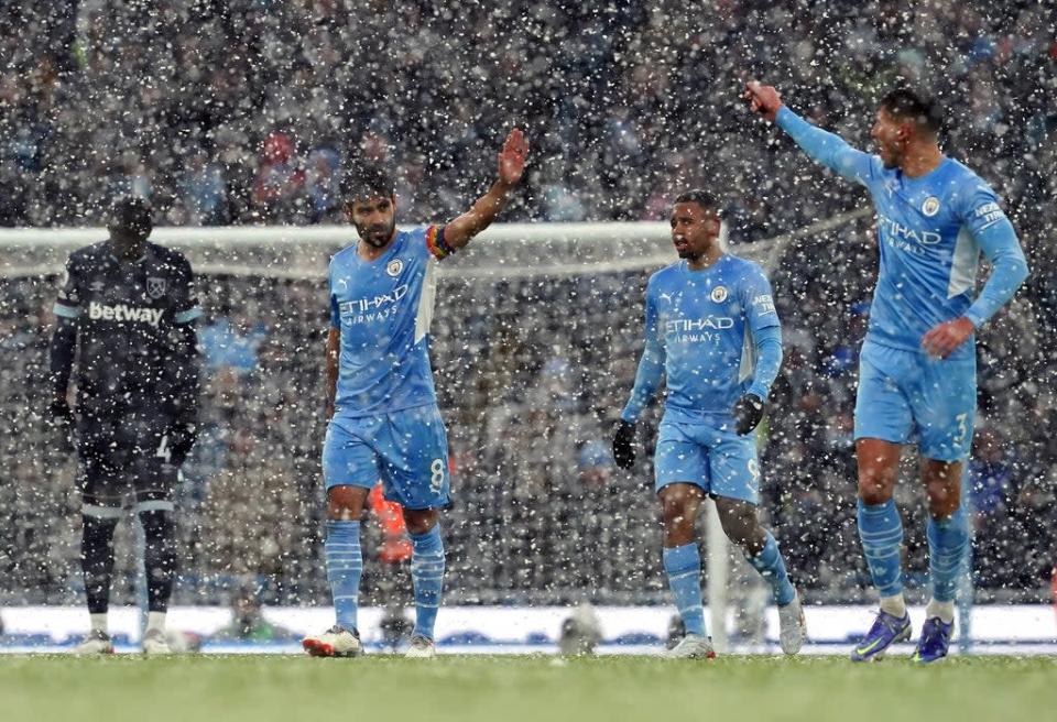 Manchester City weathered the snow to claim a hard-fought win over West Ham (Martin Rickett/PA) (PA Wire)