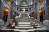 <p>Kentucky Public school teachers sit outside the House chamber as they rally for a “day of action” at the Kentucky State Capitol to try to pressure legislators to override Kentucky Governor Matt Bevin’s recent veto of the state’s tax and budget bills April 13, 2018 in Frankfort, Ky. (Photo: Bill Pugliano/Getty Images) </p>