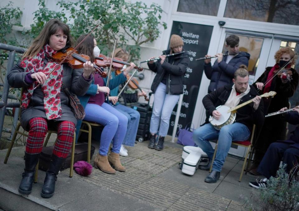 Musicians perform in Ashling Murphy’s honour outside the London Irish Centre in Camden, north London (Dominic Lipinski/PA) (PA Wire)