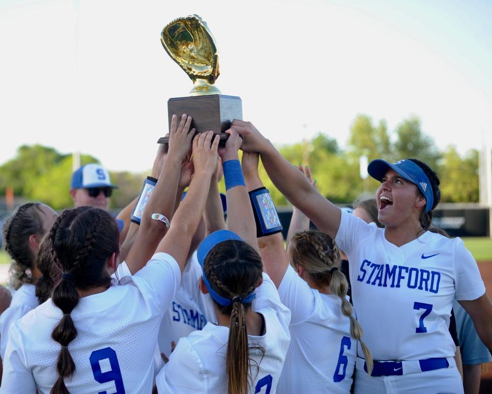 Stamford players celebrate after defeating Coleman 10-0 in the area round of the Class 2A playoffs on May 5.