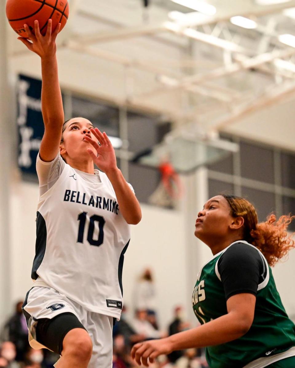 Bellarmine Prep guard Keiara Curtis (10) goes in for a layup as Emerald Ridge guard Marecia Barnett (11) defends during the first quarter of a 4A South Puget Sound League game on Friday, Jan. 28, 2022, at Bellarmine Prep, in Tacoma, Wash.