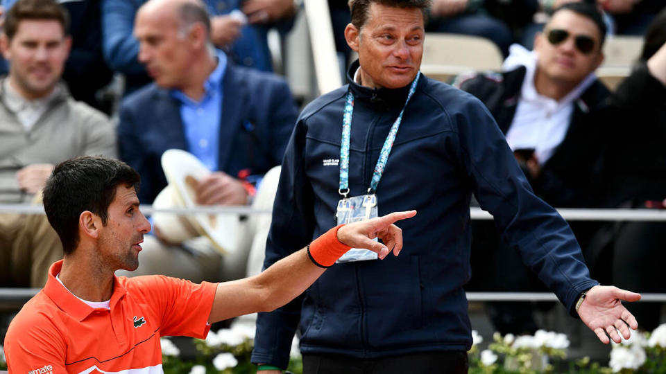 Novak Djokovic speaks to the supervisor. (Photo by PHILIPPE LOPEZ/AFP/Getty Images)