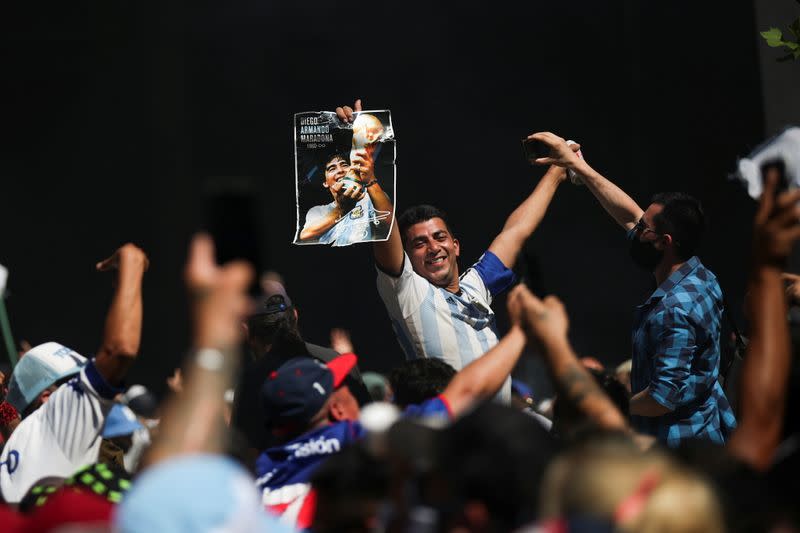 People gather to mourn the death of soccer legend Diego Armando Maradona, in Buenos Aires