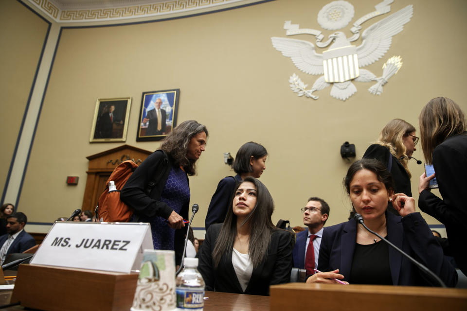 Yazmin Juárez, center, whose daughter Mariee, 1, died after being released from detention by U.S. Immigration and Customs Enforcement (ICE), takes her seat to testify at a House Oversight subcommittee hearing on Civil Rights and Civil Liberties on the treatment of immigrant children at the southern border, Wednesday, July 10, 2019, on Capitol Hill in Washington. (AP Photo/Jacquelyn Martin)