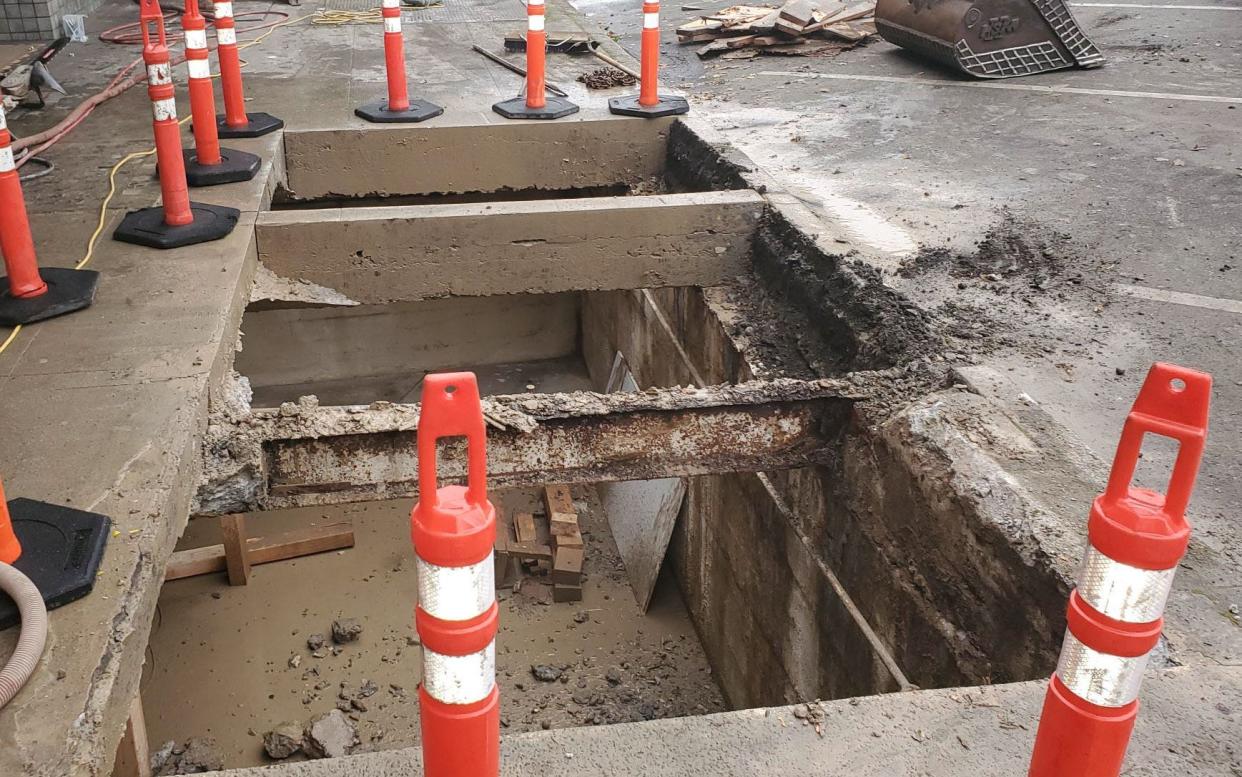 A partially filled vault during recent sidewalk improvements on Commercial Street NE. The contractor for the city used a type of concrete that flows into excavated cavities and fills all voids, then added three feet of rock before building a new sidewalk.